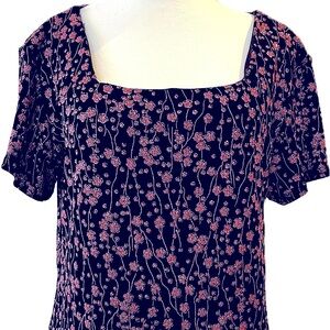 Gorgeous top with black background with small rose pink shimmering design